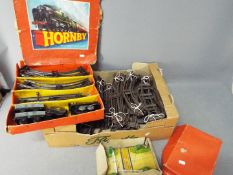 Hornby - A boxed O gauge train set, a boxed level crossing and a quantity of track.