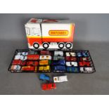 Matchbox - A carry case with 2 x trays and 27 x loose vehicles including # 55 Mercury Commuter