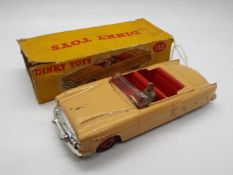 Dinky - A boxed # 132 Packard Convertible in Good condition with some signs of play use.