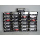 Onyx - 25 boxed diecast F1 racing cars by Onyx.