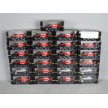 Onyx - 25 boxed diecast F1 racing cars by Onyx.