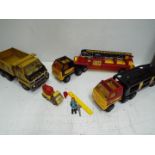 Tonka - Four vehicles and two figures.