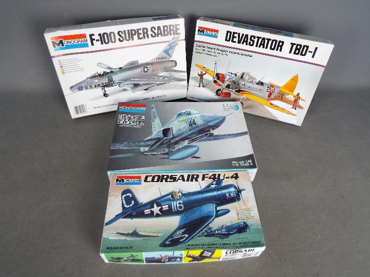 Monogram - A group of 4 x military aircraft kits in 1:48 scale including # 5416 F-100 Super Sabre,