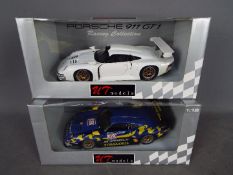 UT Models - two 1:18 scale diecast Racing Collection cars by UT Models, both Porsche 911 GT 1,