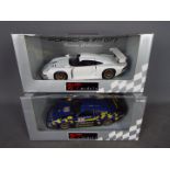 UT Models - two 1:18 scale diecast Racing Collection cars by UT Models, both Porsche 911 GT 1,