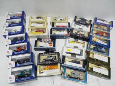 Lledo - Diecast Vehicles = Cars, Buses and Vans. Approximately x 30, all in original Boxes.