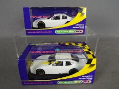 Scalextric USA - two 1:32 scale models comprising #C2605 Chevrolet Monte Carlo Plain White and