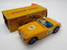 Dinky - A boxed # 109 Austin Healey 100 Sports in Yellow Competition trim in Fair to Good condition