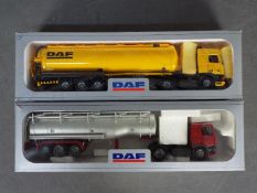 Tekno - 2 x boxed 1:50 scale DAF tanker trucks, one in yellow and one in maroon and silver.