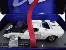 Le Mans - Slot Car in 1:32 Scale - Ford GT 40 No. 11 - 24. Drivers - Ghinther and Gregory.