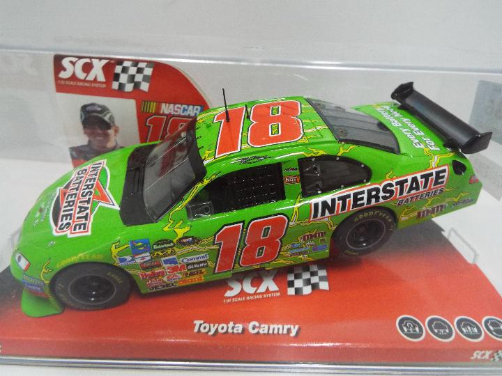 SCX - Slot Car model in 1:32 Scale - # 64390 Toyota Camry Interstate Batteries.