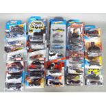 Hot Wheels - 24 carded plus a boxed 5 pack 'Batman ' and 'Avengers' themed the Hot Wheels.