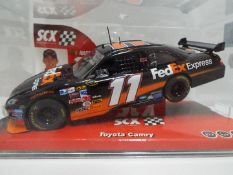 SCX - Slot Car model in 1:32 Scale - # 64110 Toyota Camry Fed Ex Express.