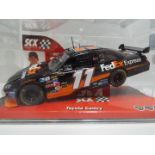 SCX - Slot Car model in 1:32 Scale - # 64110 Toyota Camry Fed Ex Express.