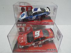 SCX - 2 x Slot Cars in 1:32 scale. # 63360 Dodge Charger Kahne and # 62200 2006 Dodge Charger.