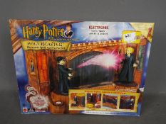 A Harry Potter And The Philosopher's Stone Powercaster electronic spell-casting playset by Mattel,
