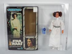 Star Wars, Kenner - A graded Kenner 1977 Star Wars 'Princess Leia' large 12" action figure.