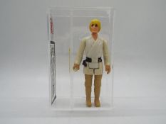 Star Wars - A loose vintage and graded Star Wars 'A New Hope' 3 3/4 action figure 'Luke Skywalker -