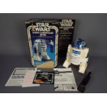 Star Wars - Kenner - A boxed 1978 Radio Controlled 8" R2-D2 with light and sound. # 38430.