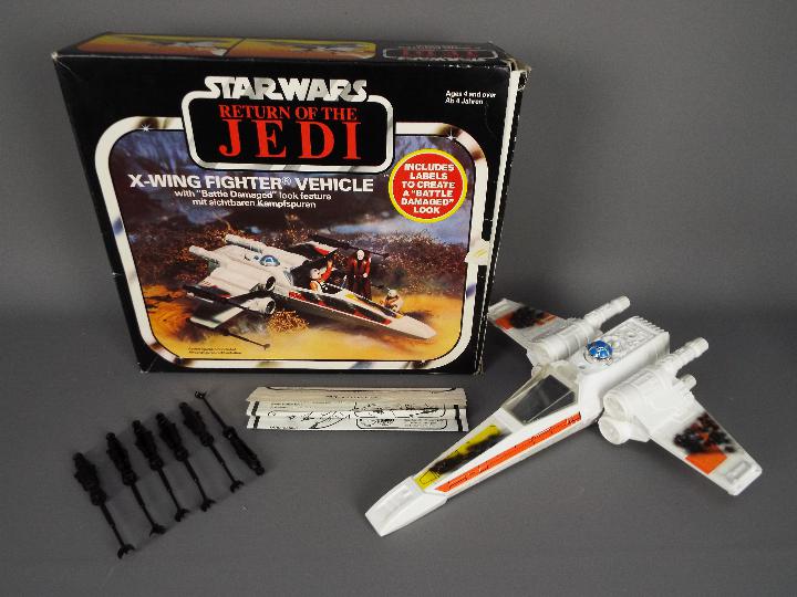 Star Wars - A boxed, vintage Kenner X Wing Fighter Vehicle with Battle Damaged look feature,