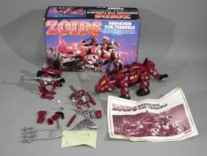 Tomy, Zoids - A boxed Tomy #5902 Zoids 'Redhorn The Terrible', which is in a deconstructed state,