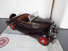 Danbury Mint - A boxed Danbury Mint 1:24 scale 1935 Chevrolet Standard Sports Roadster.