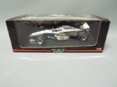 Minichamps - A boxed 1:18 scale Minichamps # 530981808 McLaren MP4/13 'M.