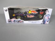 Minichamps - A boxed Minichamps #110120071 Limited Edition 1:18 scale Red Bull Racing Showcar 2012