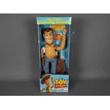 Thinkway Toys - Disney - A boxed pull string talking Sheriff Woody doll from Toy Story. # 62943.