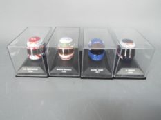 Minichamps - Four boxed 1:8 scale F1 racing drivers helmets by Minichamps.