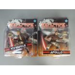 Joyride - Two carded Battlestar Galactica action figures by Joyride, including Apollo and Starbuck.