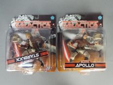 Joyride - Two carded Battlestar Galactica action figures by Joyride, including Apollo and Starbuck.