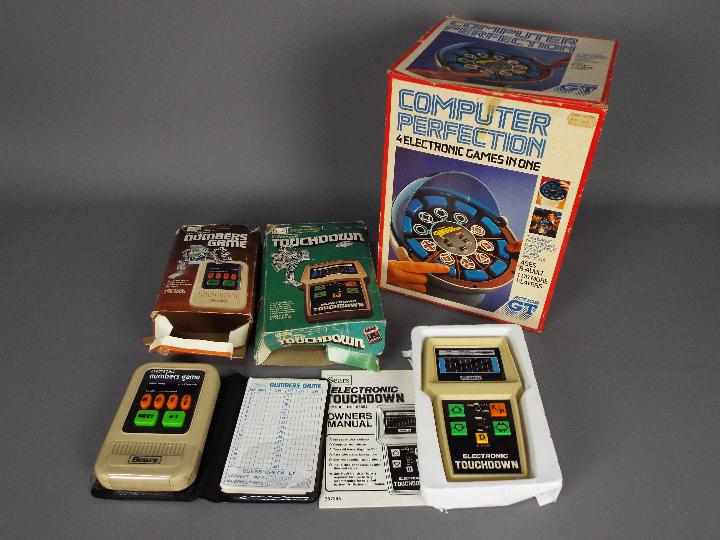 Action GT, Sears - Three boxed vintage electronic games.