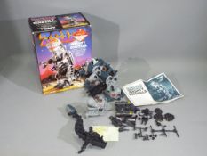 Tomy, Zoids - A boxed Tomy #5900 Zoids 'Mighty Zoidzilla', which is in a deconstructed state,