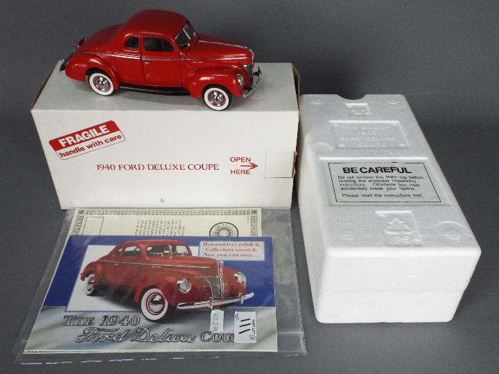 Danbury Mint - A boxed Danbury Mint 1:24 scale 1940 Ford Deluxe Coupe.