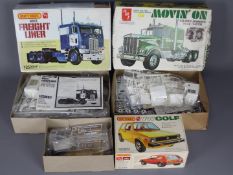 Matchbox, AMT - Three boxed plastic model kits in 1:25 scale.