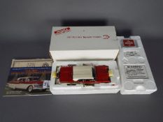 Danbury Mint - A boxed Danbury Mint 1:24 scale 1957 Mercury Turnpike Cruiser.