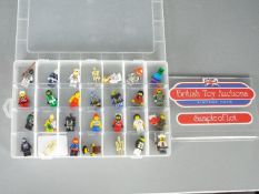 Lego - A collection of 84 x figures and a selection of Lego parts and pieces,