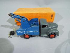 Dinky - A boxed # 25X Commer Breakdown Lorry in grey and blue in an orange lift off lid style box.