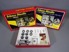 Schuco - A boxed Schuco Studio tinplate Mercedes racing car set with tools to fit and change the