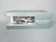 Minichamps - A boxed 1:18 scale Minichamps #B66960091 Mercedes GP Petronas MGP W01 Formula 1 Racing