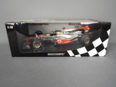 Minichamps - A boxed Minichamps #530111873 Limited Edition 1:18 scale Vodafone McLaren Mercedes