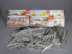 LEGO - A quantity of vintage boxed Lego sets and accessories for Lego train sets.