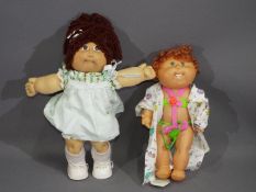 Hasbro - Two unboxed vintage Cabbage Patch Dolls.