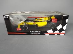 Minichamps - A boxed 1:18 scale Minichamps #150100081 Renault F1 Team Showcar 2010 'R.Kubica'.