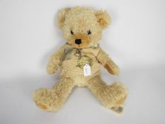 Steiff - one teddy bear - lot includes a Steiff teddy bear dressed in a "Steiff Jungle" vest.