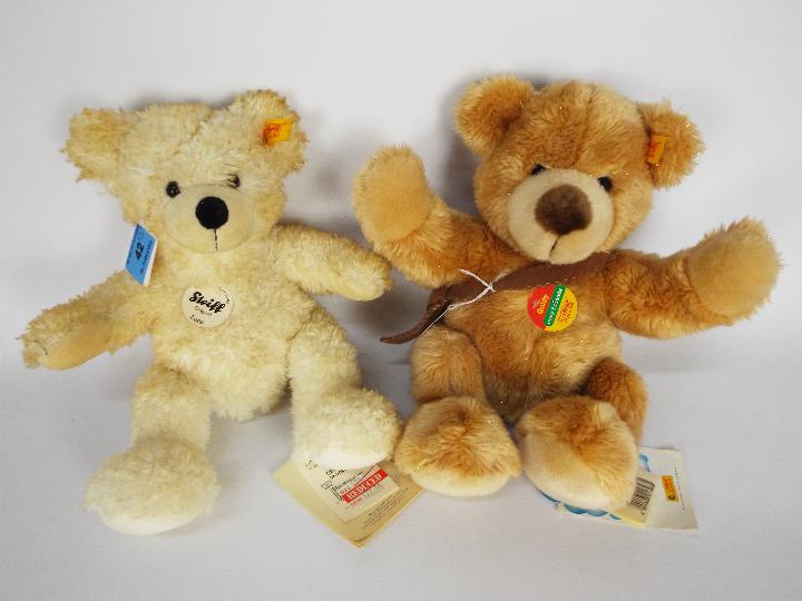 Steiff - two teddy bears - lot includes a "Goldy" Steiff bear that is wearing a brown satchel and