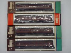 Lima - Four boxed Lima N gauge passenger coaches predominately in BR maroon livery.