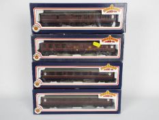 Bachmann - A rake of four boxed OO gauge passenger coaches in BR maroon livery by Bachmann.