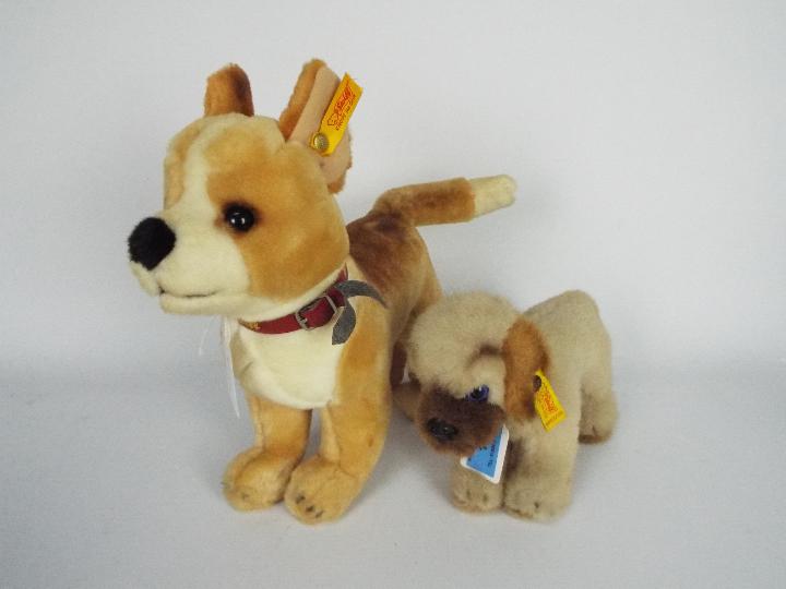 Steiff - two dogs - lot includes two Steiff dogs. One dog has a Steiff collar around its neck.